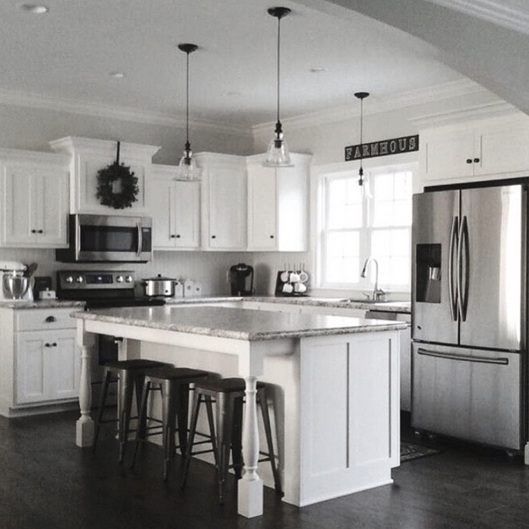 kitchen with granite countertops and white cabinetry